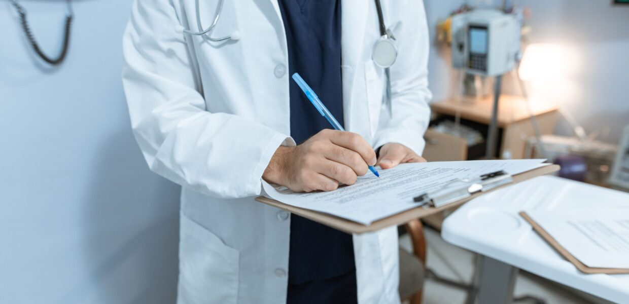 A doctor making notes