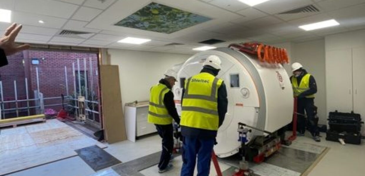 Contractors putting the new MRI scanner into place