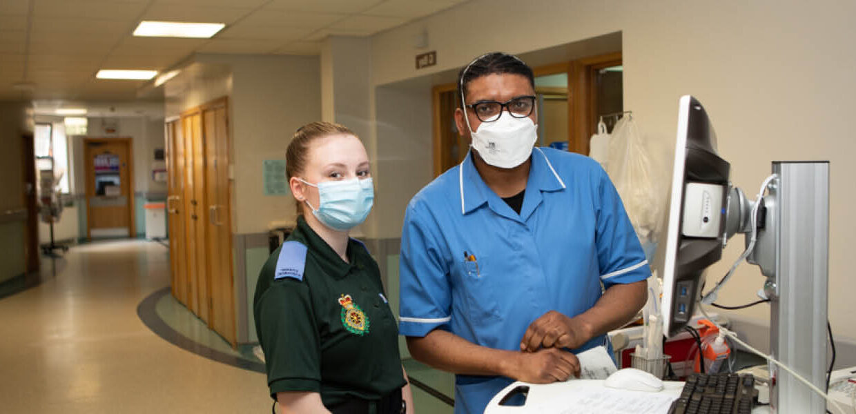 doctor and paramedic using computer