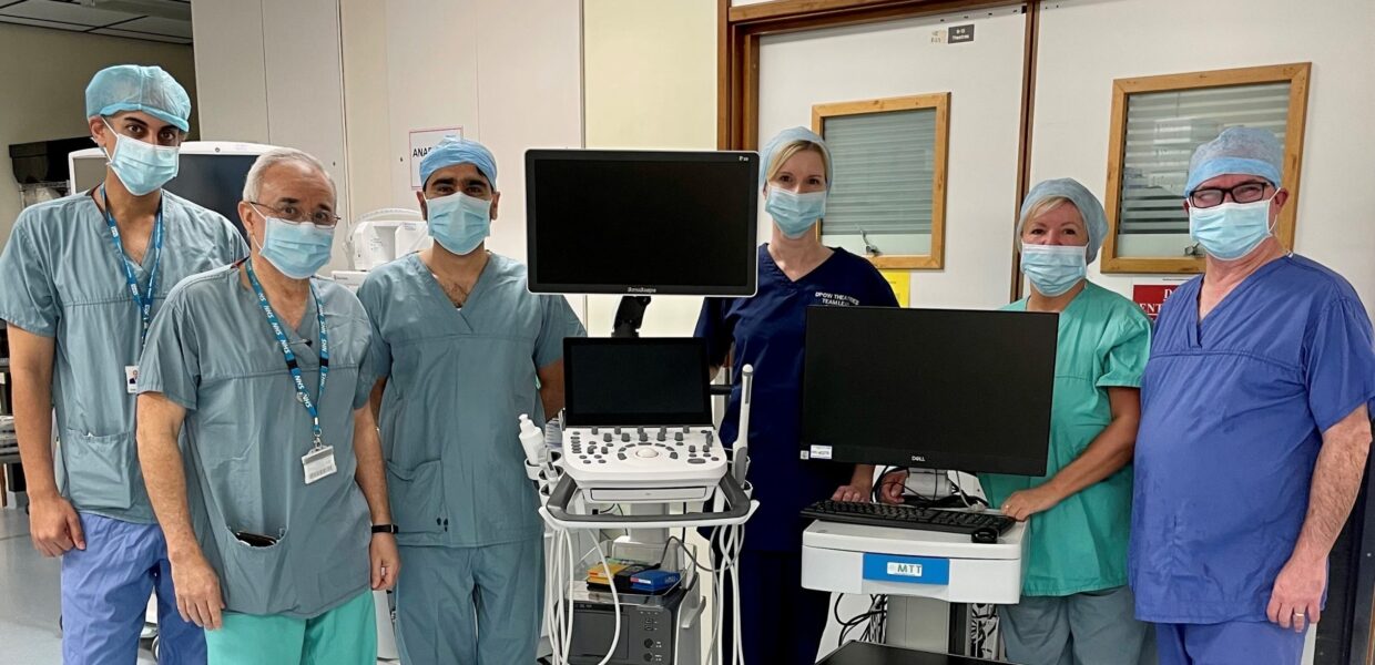 Urology staff pictured with a fusion biopsy machine at Grimsby hospital.