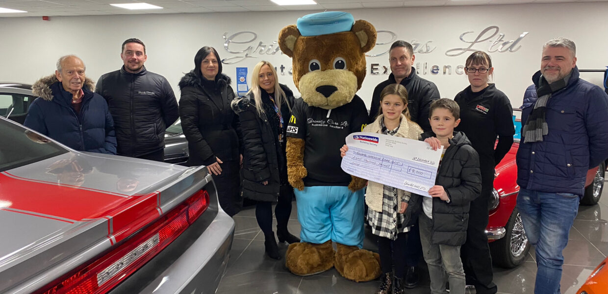 A group of fundraisers presenting a cheque to The Health Tree Foundation.